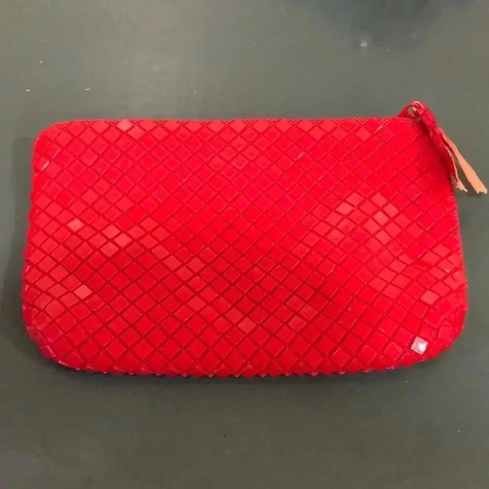 La Regale red mesh clutch.